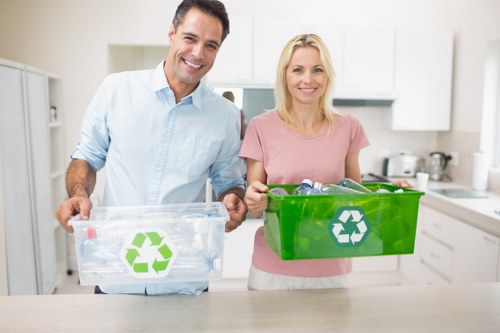 Waste removal team operating advanced equipment